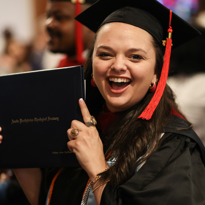 Graduate resident celebrating her new master's degree