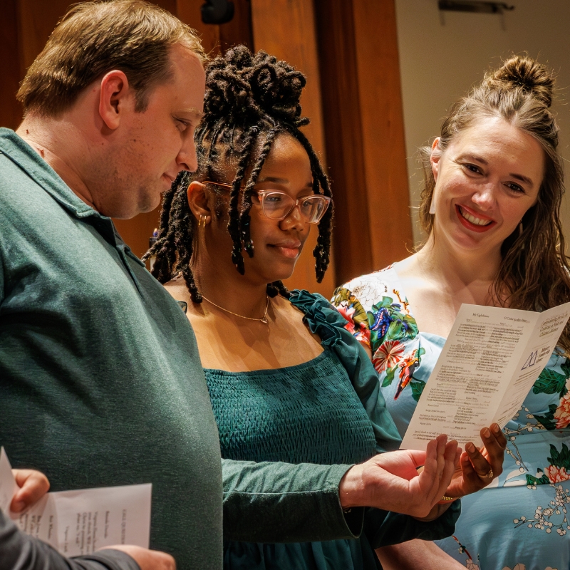 Certificate graduates reading together