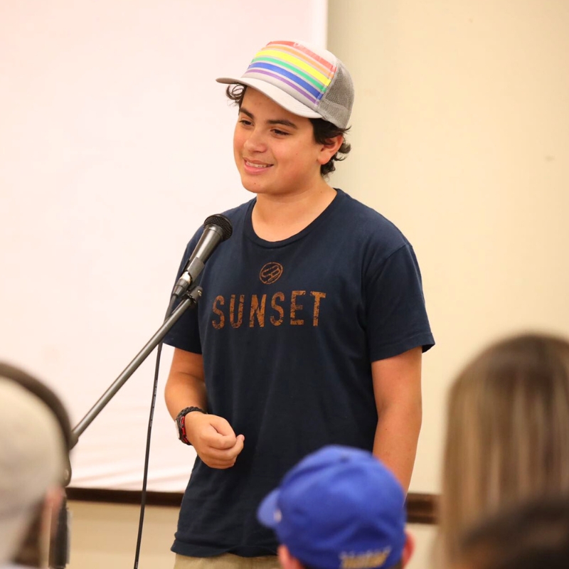 Teen engaged in thoughtful discussion about faith